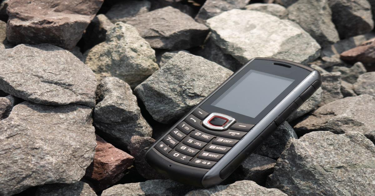 a 2g mobile phone on rocks