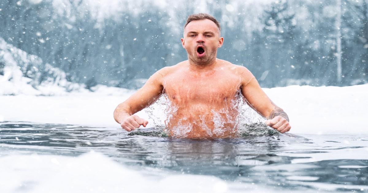 man jumping in cold water shocked