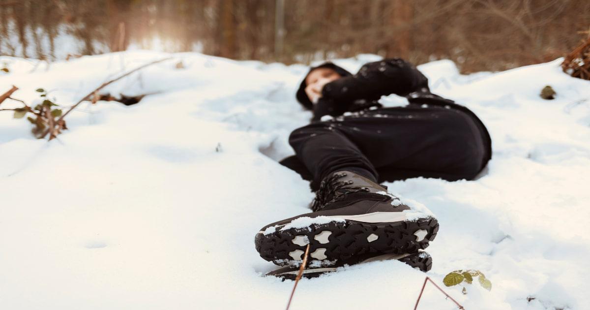 man lying in snow hypothermia