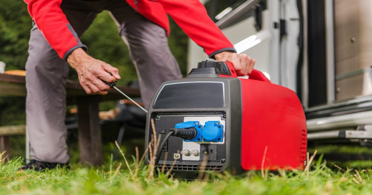 man pulling generator for camping power survival