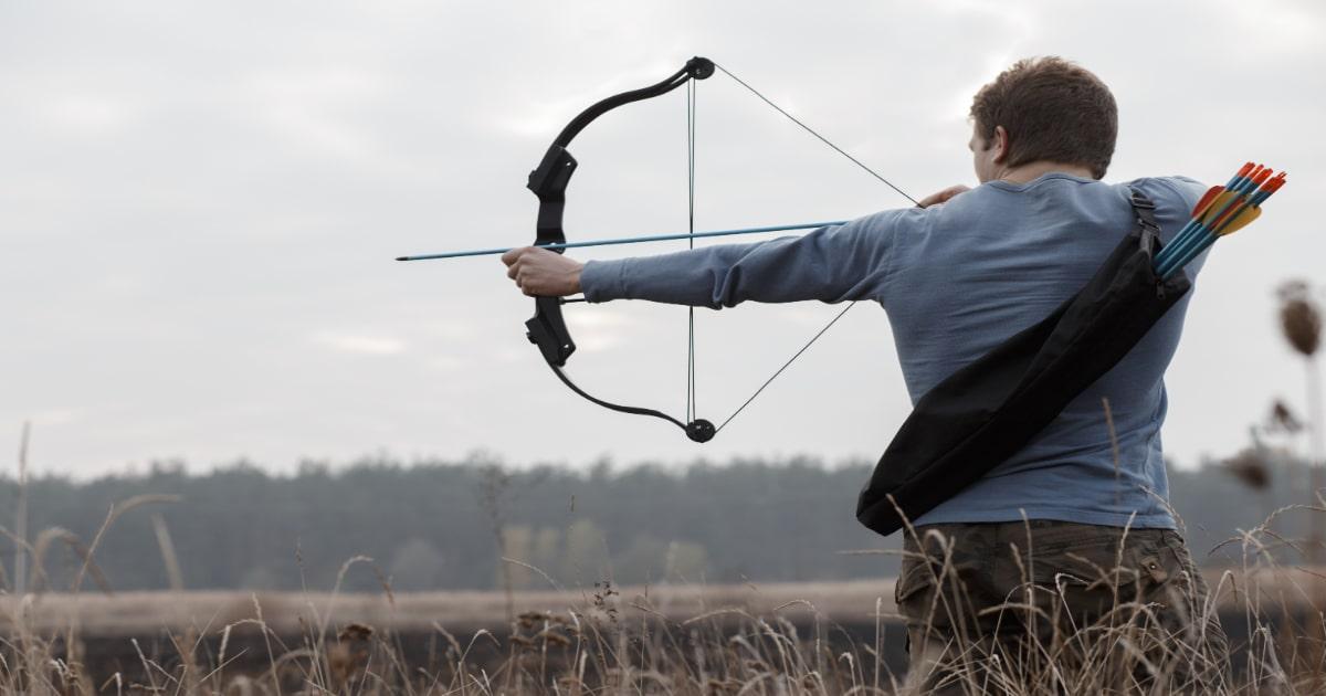 man shooting a legal bow and arrow weapon