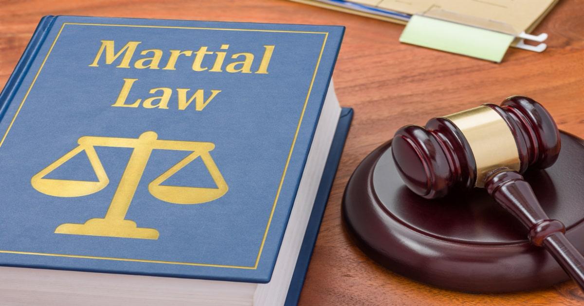 martial law gavel and book on desk